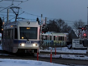 Edmonton Transit System's Metro Line LRT train crosses Princess Elizabeth Avenue as it pulls into the NAIT station during evening rush-hour.