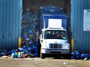 A truck dumps a load of recycle bags at the Material Recovery Centre in Edmonton. Alberta on Friday, Oct 25, 2013.