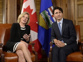 Prime Minister Justin Trudeau and Alberta Premier Rachel Notley speak during a meeting on Parliament Hill, Tuesday, Nov. 29, 2016 in Ottawa.