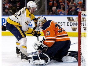Edmonton Oilers goalie Cam Talbot makes a save against the Nashville Predators' Ryan Johansen at Rogers Place in Edmonton on Thursday, March 1, 2018. (David Bloom)
