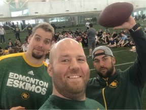 Edmonton Eskimos players Matt O'Donnell, Justin Sorensen and Ryan King participate in a flag football clinic for junior high school students at the Commonwealth Stadium fieldhouse on March 15, 2018.