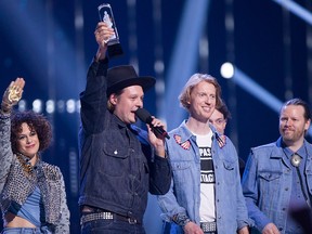 Arcade Fire celebrates their Juno for Album of the Year at the Juno Awards in Vancouver, Sunday, March, 25, 2018.