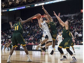 Ryerson University Rams' Manny Diressa drives to the net while surrounded by University of Alberta Golden Bears in the quarter-final round of the U Sports national championships in Halifax on Thursday, March 8, 2017.