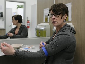 Katrina Stephenson, the staff nurse at the Boyle Street Community Services Supervised Consumption Site, demonstrates the procedure that clinic users will go through when using the site, which opens Friday March 23, 2018. This is the first safe consumption site to open in Edmonton. (PHOTO BY LARRY WONG/POSTMEDIA) Story by Hina Alam