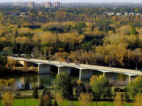 The Groat Road Bridge is surrounded by a colorful autumn palette in Edmonton's river valley on Wednesday October 4, 2017.