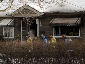 Fie investigators inspect a fire that occurred at 5807 109 Street on Tuesday, Feb. 27, 2018 in Edmonton.