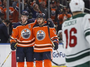 Edmonton Oilers centre Connor McDavid (97) and defenceman Andrej Sekera (2) celebrate a goal against the Minnesota Wild during second period NHL action in Edmonton on March 10, 2018.