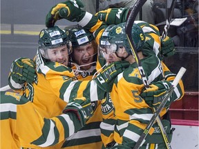 University of Alberta Golden Bears players celebrate after scoring against the St. Francis Xavier University X-Men in first period USports University Cup action at the Canadian university men's hockey championship gold medal game in Fredericton, N.B., on March 18, 2018.