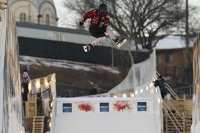 Canada's Steven Cox does a trick in the freestyle event during Red Bull Crashed Ice competiton in downtown Edmonton, Alberta on Friday, March 9, 2018.