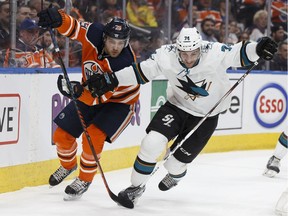 Edmonton's Leon Draisaitl (29) battles San Jose's Dylan DeMelo (74) during the first period of a NHL game between the Edmonton Oilers and the San Jose Sharks at Rogers Place in Edmonton, Alberta on Wednesday, March 14, 2018.