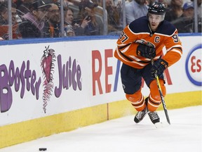 Edmonton Oilers star Connor McDavid  chases a puck during  NHL action against the San Jose Sharks at Rogers Place in Edmonton on March 14, 2018.