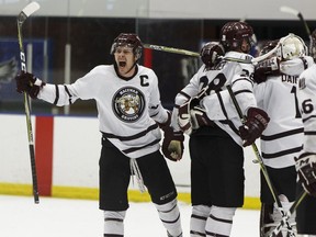 The MacEwan Griffins celebrate winning Game 3 and the Alberta Colleges Athletic Conference men's hockey final versus the NAIT Ooks at Northern Alberta Institute of Technology in Edmonton on March 18, 2018.