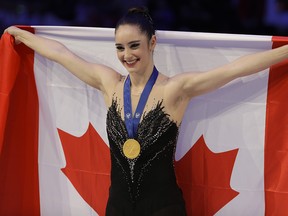 Kaetlyn Osmond of Canada celebrates after winning the women's free skating program, at the Figure Skating World Championships in Assago, near Milan, Italy, Friday, March 23, 2018. (AP Photo/Luca Bruno) ORG XMIT: FP175