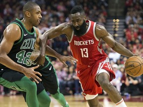 Houston Rockets guard James Harden (13) drives by Boston Celtics forward Al Horford (42) Saturday, March 3, 2018, in Houston. (AP Photo/George Bridges)