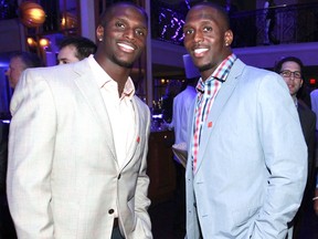 In this Jan. 31, 2013, file photo, NFL football players Jason McCourty, left, Devin McCourty pose at the VIP Reception hosted by the NFLPA in New Orleans