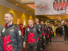 Team Canada marches their way in to the arena to participate in the 60th World Men's Curling Championships. (Bob Weder photo)