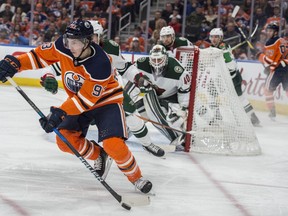 Ryan Nugent-Hopkins of the Edmonton Oilers, tries to make a play in front of goalie Devan Dubnyk of the Minnesota Wild at Rogers Place in Edmonton on March 10, 2018.