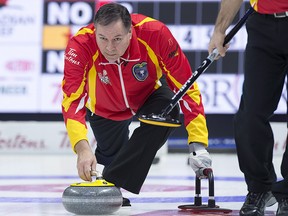 Nunavut skip David St. Louis delivers a rock as they play Northern Ontario at the Tim Hortons Brier at the Brandt Centre in Regina on Sunday, March 4, 2018. (THE CANADIAN PRESS/Andrew Vaughan)