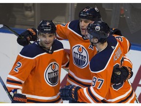 Edmonton Oilers forward Milan Lucic (27) celebrates his goal with teammates Andrej Sekera (2) and Connor McDavid (97) against the Arizona Coyotes on Monday, March 5, 2018 in Edmonton. (Greg Southam)