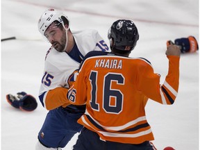 Edmonton Oilers forward Jujhar Khaira (16) and New York Islanders Cal Clutterbuck (15) duke it out in Edmonton on Thursday, March 8, 2018. (Greg Southam)