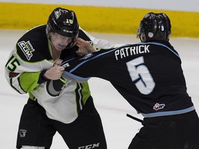 Edmonton Oil Kings Scott Atkinson and Kootenay Ice's Zachary Patrick duke it out during first period WHL action on Sunday, March 11, 2018 in Edmonton.