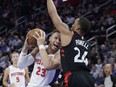 Detroit Pistons forward Blake Griffin (23) looks to shoot as Toronto Raptors forward Norman Powell defends Wednesday, March 7, 2018, in Detroit. (AP Photo/Carlos Osorio)