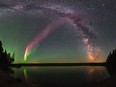 The celestial phenomenom known as "Steve" and the Milky Way are shown in the sky over Childs Lake, Manitoba in a handout photo.