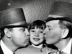 Eight-year-old Moira Hogan is kissed on the cheek by her brother Patrick, left, and Timothy Coghlain during a St. Patrick's Day dance held by the Irish Sports and Social Society at the Edmonton Inn, March 17, 1967.
