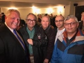 Tarek Fatah poses with Doug Ford and friends at a recent political event. (Submitted photo.)