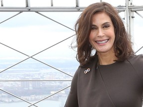 Actress Teri Hatcher lights the Empire State Building orange in a special ceremony to commemorate the International Day to End Violence Against Women and the 16 Days of Activism against Gender Violence on November 24, 2014 in New York City. (Taylor Hill/Getty Images)