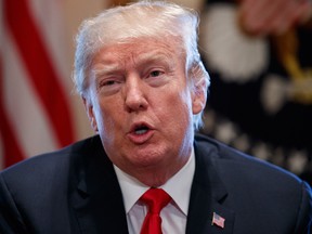 President Donald Trump speaks during a meeting with steel and aluminum executives in the Cabinet Room of the White House, Thursday.