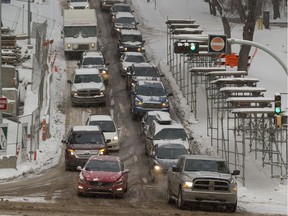 Drivers make their way down 106th street towards 97 avenue on a cold snowy Friday, Feb. 2, 2018 in Edmonton.