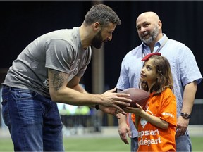 Edmonton Eskimos quarterback Mike Reilly offers some tips during a Jumpstart event at the RBC Convention Centre that is part of CFL Week in Winnipeg on Thurs., March 22, 2018. Over 150 kids from Greenway and Victory schools were able to participate in drills with current CFL stars. Kevin King/Winnipeg Sun/Postmedia Network