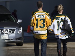 Mourners wearing Humboldt Broncos jerseys arrive for the funeral service of Humboldt Broncos' player Conner Jamie Lukan in Slave Lake Wednesday April 18, 2018. Photo by David Bloom