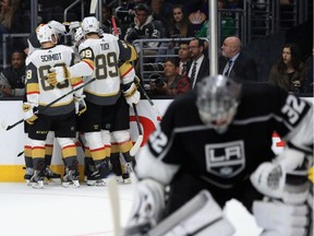 Nate Schmidt #88 and Alex Tuch #89 congratulate James Neal #18 of the Vegas Golden Knights after scoring a goal while goalie Jonathan Quick of the Los Angeles Kings looks on during Game 3 of  their NHL playoff series at Staples Center on April 15, 2018, in Los Angeles.