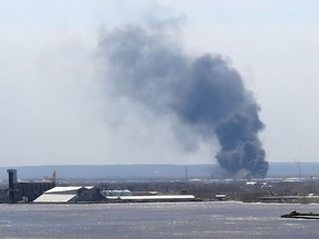Smoke from an explosion at the Husky Energy oil refinery in Superior, Wisconsin on April 26, 2018 is seen from across the lake in Duluth, Minnesota.