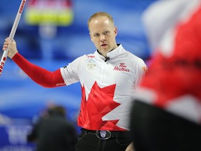 Canada third Mark Nichols watches his shot as they take on South Korea at the men's world curling championship in Las Vegas on April 3, 2018