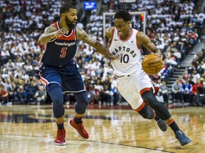 Raptors guard DeMar DeRozan (right) drives to the basket against Wizards' Markieff Morris during Game 1 of the NBA Eastern Conference Playoffs at the Air Canada in Toronto on Saturday, April 14, 2018. (Ernest Doroszuk/Toronto Sun/Postmedia Network)