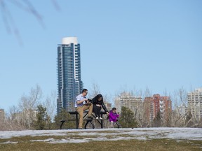 A young family used a picnic bench for some family photos in Edmonton's Hawrelak Park on Saturday, April 13, 2018.