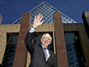 Edmonton City Councilor Ron Hayter waves in front City Hall as he poses for a photo, Ron Hayter is the longest serving Councillor in Edmonton's history.