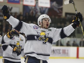 Spruce Grove Saints forward Chris Van Os-Shaw celebrates a goal on Okotoks Oilers goaltender Riley Morris (33) during the first period of Game 3 of the AJHL finals at Grant Fuhr Arena in Spruce Grove, on April 16, 2018.