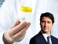 alongside a headshot of Prime Minister Justin Trudeau during a press conference on Parliament Hill in Ottawa on Wednesday, April 4, 2018.