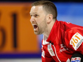 Canada skip Brad Gushue yells to sweepers after delivering a stone against Sweden during the world men's curling championship on April 6, 2018