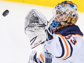 Edmonton Oilers goalie Cam Talbot (catches the puck during NHL action against the host Vancouver Canucks on March 29, 2018.