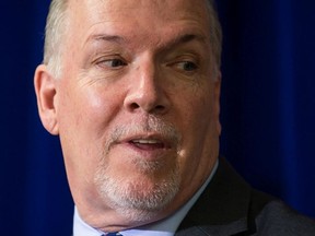 British Columbia Premier John Horgan listens during a housing announcement in Coquitlam, B.C., on Friday April 13, 2018.