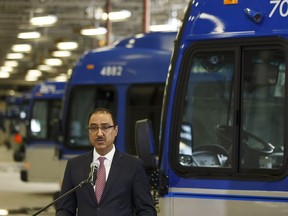 Amarjeet Sohi, federal Minister of Infrastructure and Communities, speaks during the signing of a bilateral agreement that will provide more than $3.3 billion in federal funding for infrastructure at the Edmonton Transit System's Centennial Garage in Edmonton, on Tuesday, April 3, 2018.