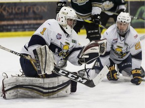 Spruce Grove Saints goaltender Nolan Kent makes a save on the Okotoks Oilers during the second period of Game 3 of the AJHL finals at Grant Fuhr Arena in Spruce Grove, on April 16, 2018.