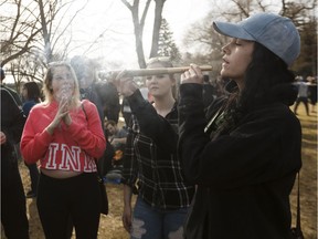 Revelers smoke a big joint during the 4-20 marijuana rally at the Alberta legislature in Edmonton, on Friday, April 20, 2018.