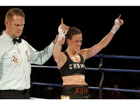 Jelena Mrdjenovich celebrates beating Stephanie Ducastel in the main event at K.O Boxing 82 at the Shaw Conference Centre in Edmonton, on Saturday, April 28, 2018. (Ian Kucerak)