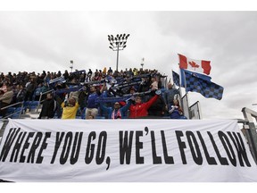 Eddies fans sing the national anthem during an Al Classico exhibition game between FC Edmonton Academy and Calgary Foothills at Clarke Stadium in Edmonton, on Sunday, April 29, 2018. Photo by Ian Kucerak/Postmedia Photos for copy in Monday, April 30 edition.